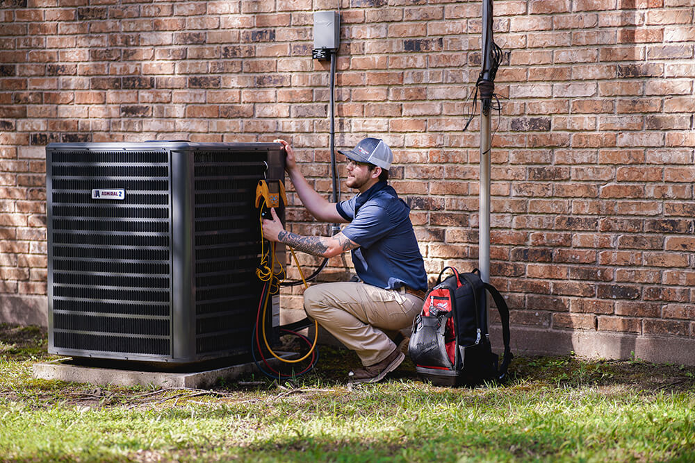 service tech with new ac unit